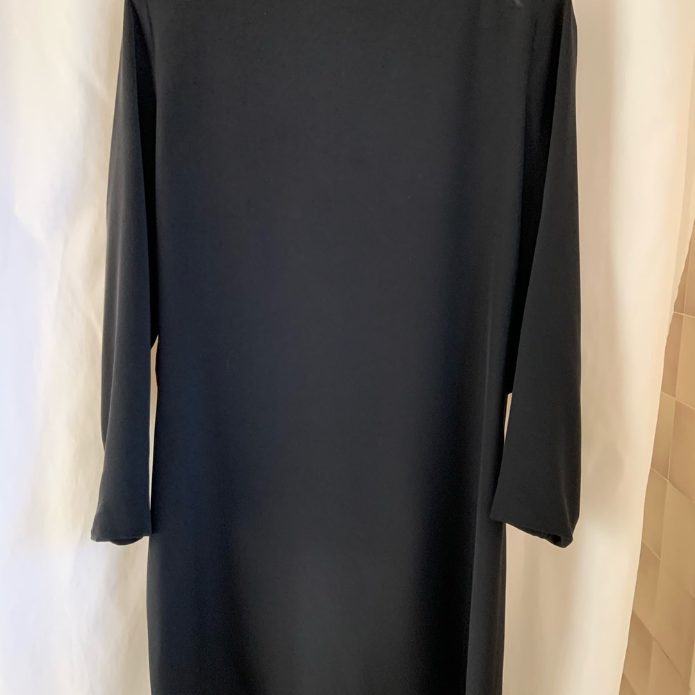 Silk shantung with low-cut back. Back zipper. Length 34” shoulder to hem.